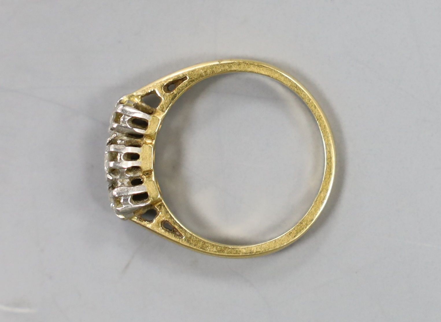 An 18ct & plat, three stone diamond set ring, size G/H, gross weight 2.2 grams.